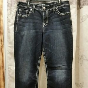 Dark wash boot cut jeans.